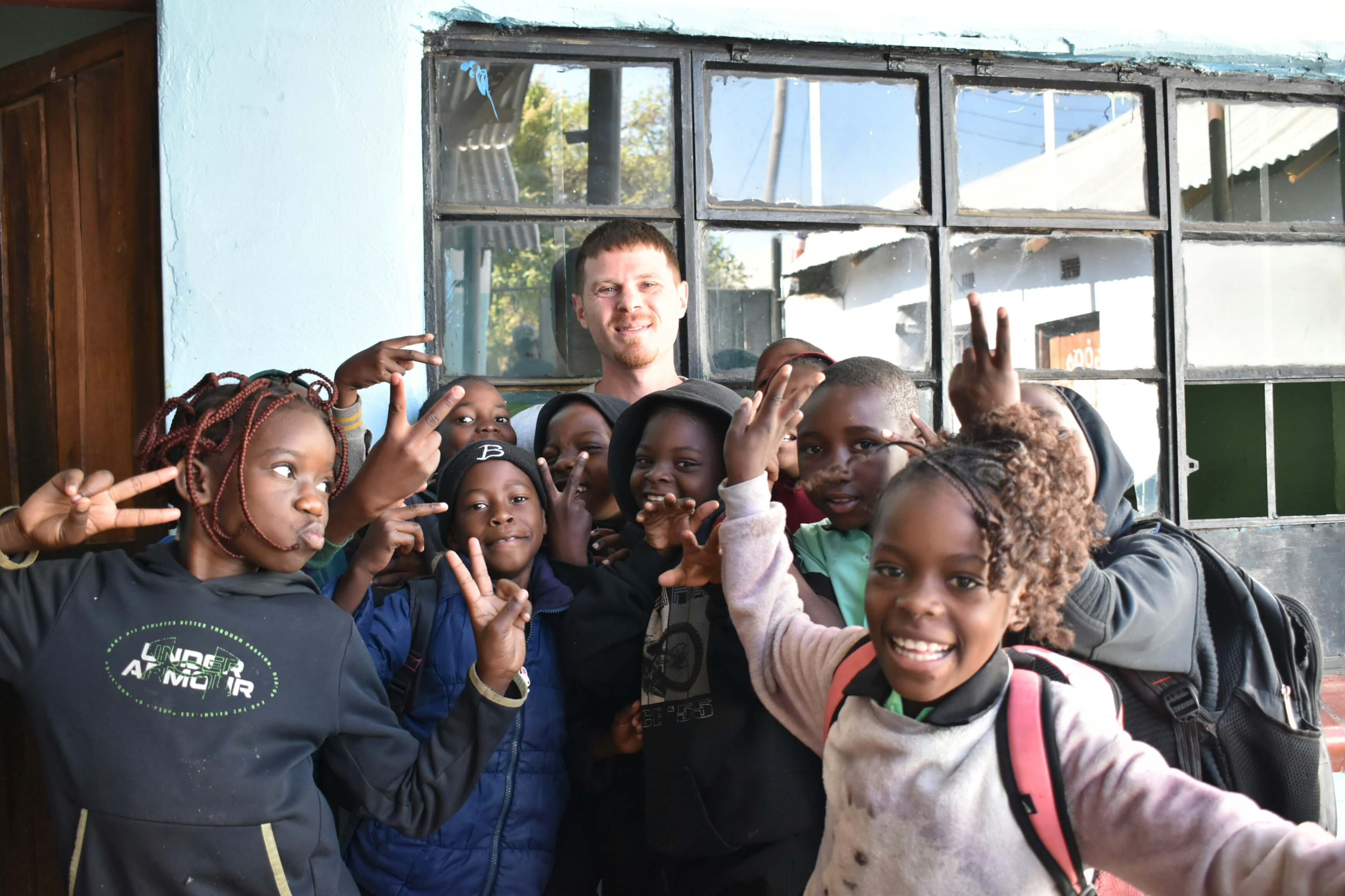 A teacher guiding pupils through a classroom activity