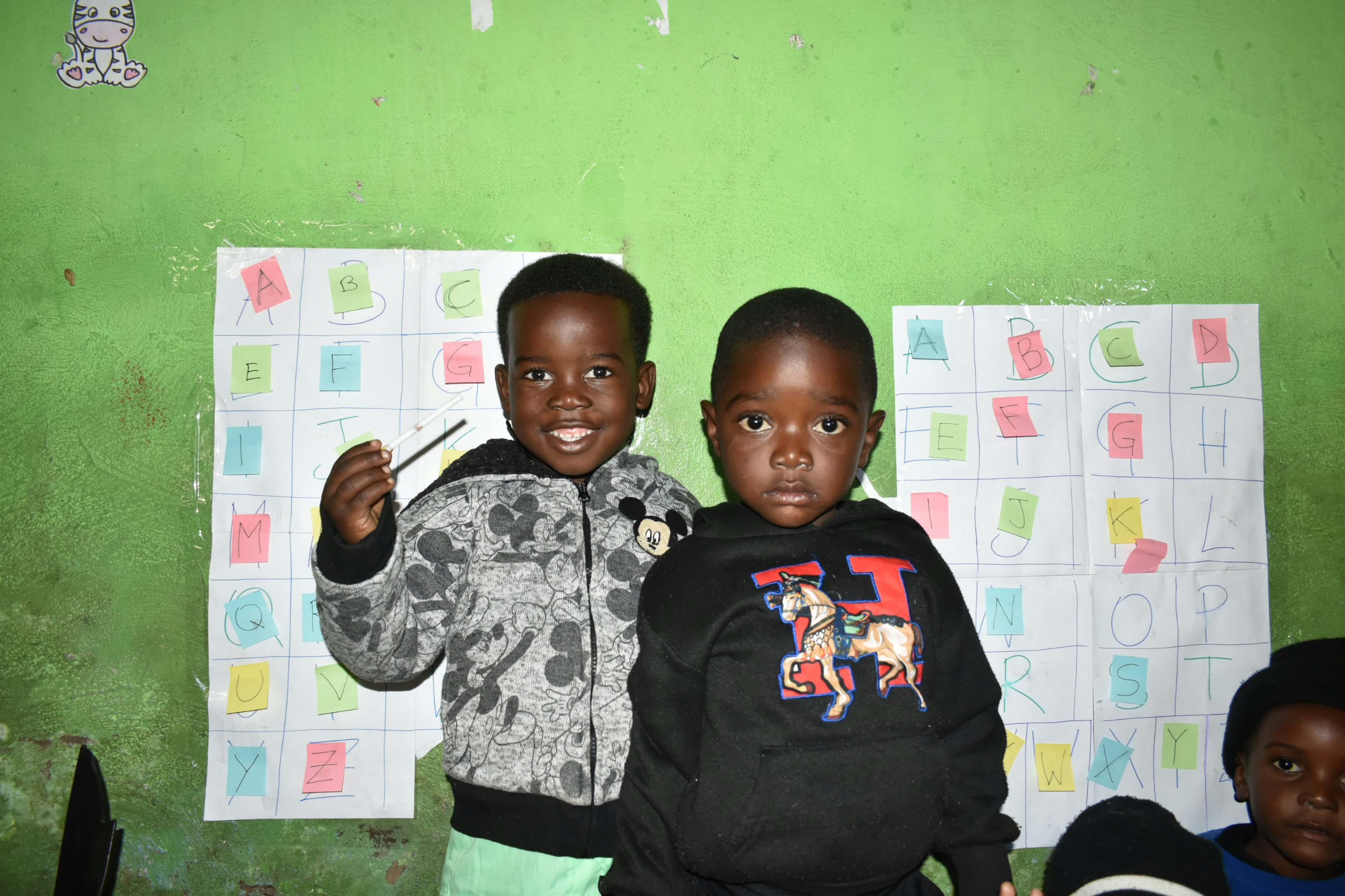 A parent and child arriving at Determined Primary School
